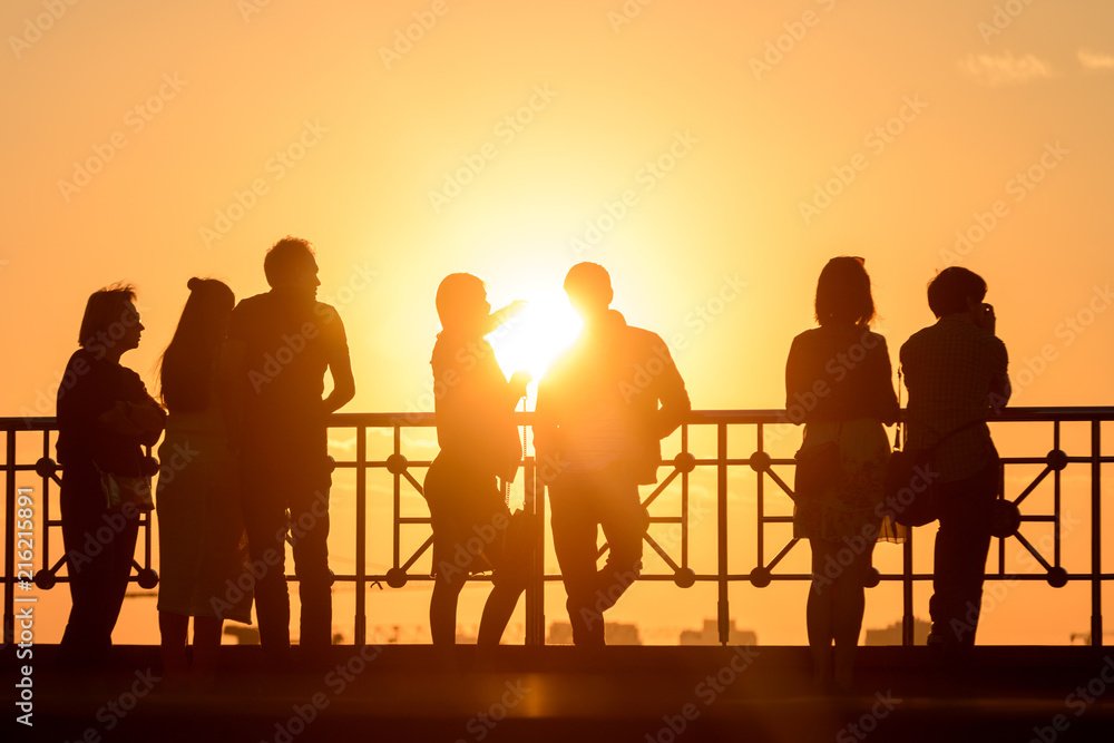 People looking on sunset