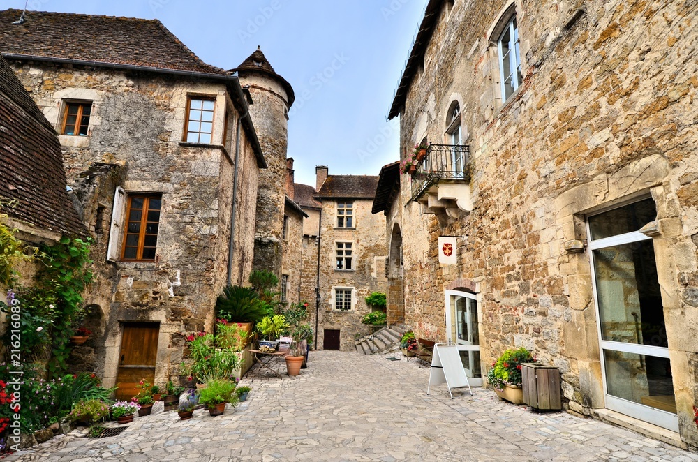 Picturesque medieval street the beautiful Dordogne village of Carennac, France