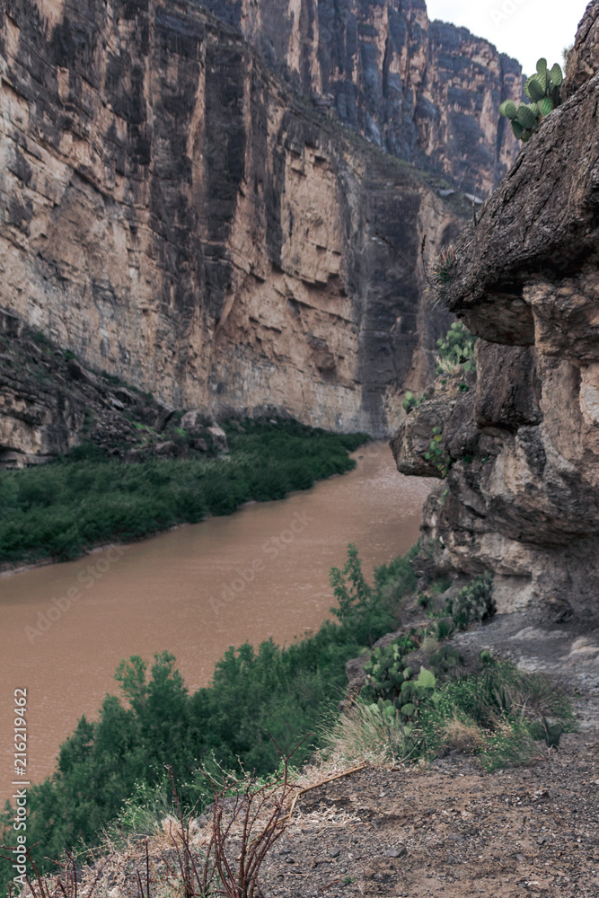The Rio Grande River running between a mountain range splitting the United States and Mexico