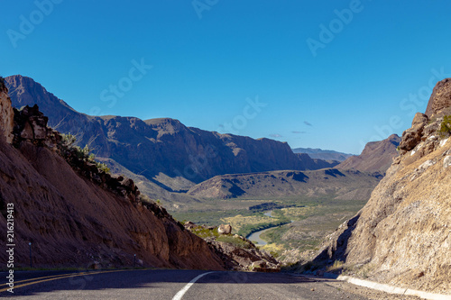 A beautiful landscape of mountains and river along the Texas Mexico border with blue sky 