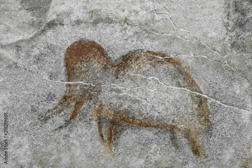 a drawing of a mammoth on a cave wall painted by an ancient man. long time. archeology. era.