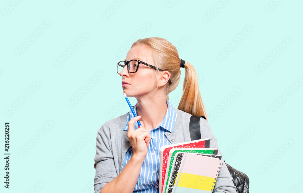 Happy young student girl holding books. Back to school Happy young student girl holding books. Back to school