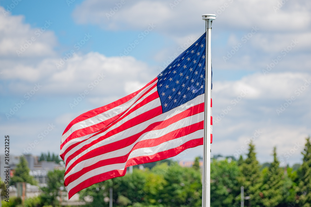 United states flag on cloudy background United states flag on cloudy background