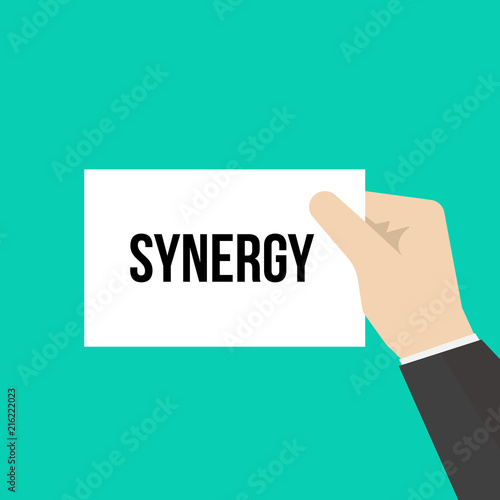 Man showing paper SYNERGY text