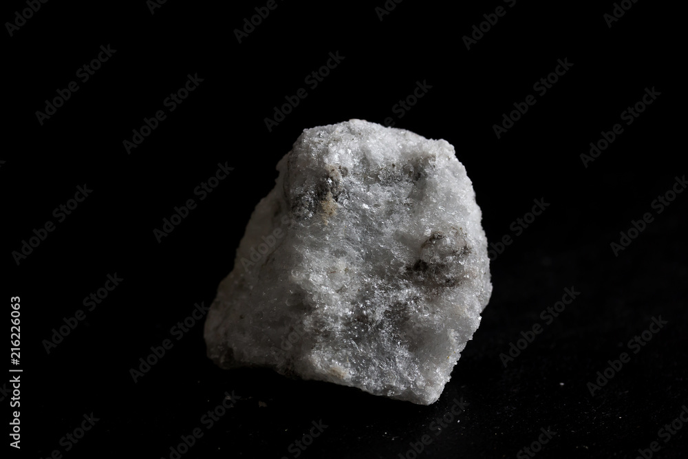 Gypsum(alabaster) stone isolate on black background
