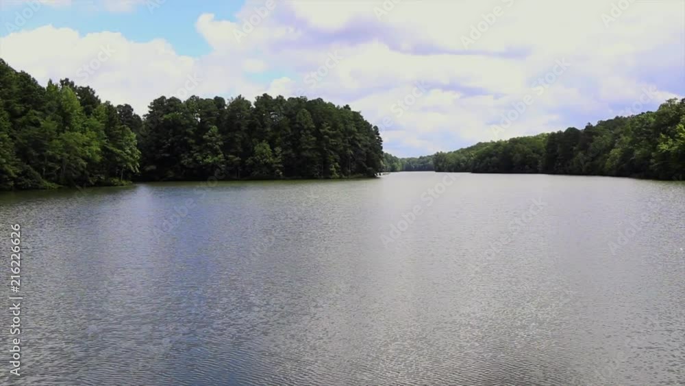This is a clip of a lake on a cloudy day. This is a clip of a lake on a cloudy day.