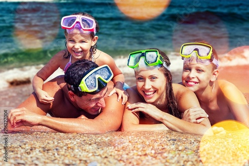 Happy family on vacations on beach