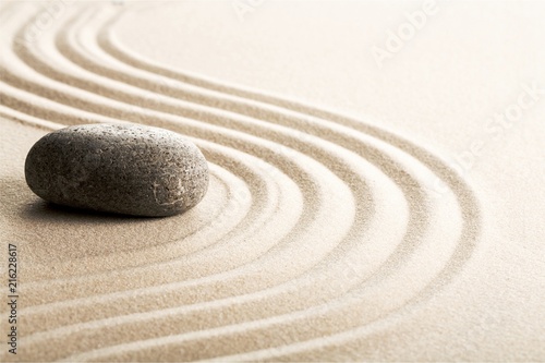 Zen stones in the sand. Grey background