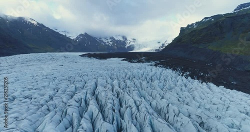Rotating aerial wide view of glacier valley