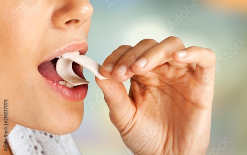 Beautiful girl eating gum