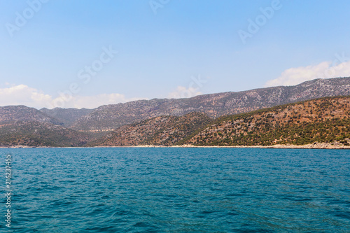 Summer seascape with a mountain massif.