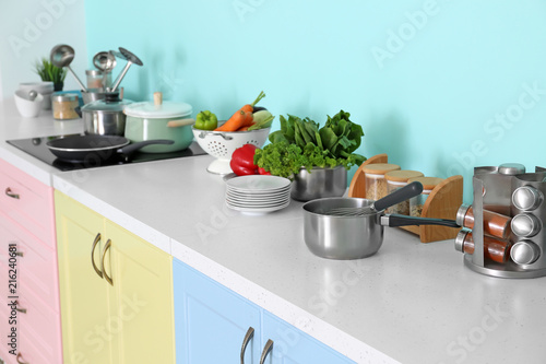 Cookware on table in modern kitchen