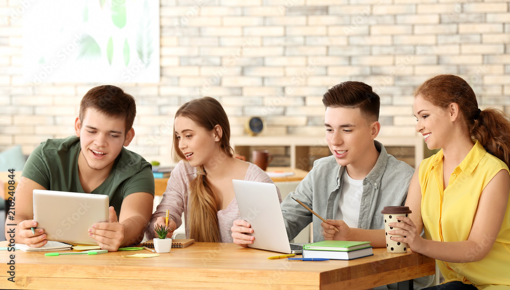 Group of teenagers studying indoors