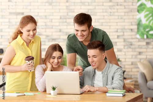 Group of teenagers with lap...