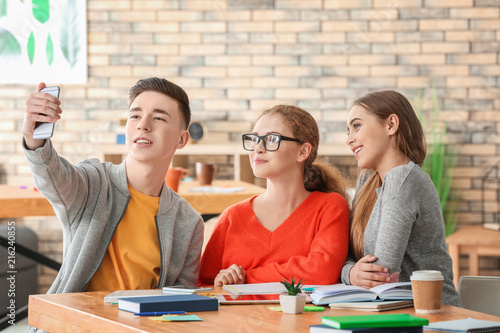 Group of teenagers taking s...