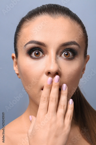 Emotional young woman with ...