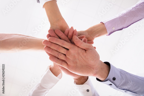 Close-up Of Businesspeople Stacking Hands