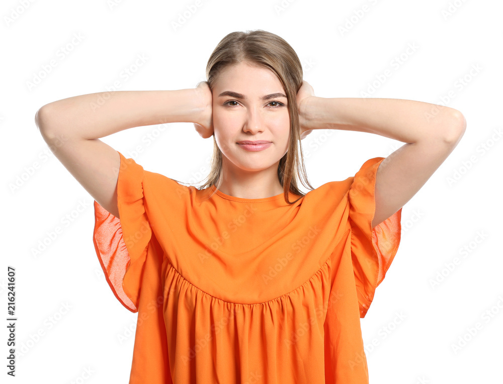 Young woman with hearing problem covering her ears on white background Young woman with hearing problem covering her ears on white background