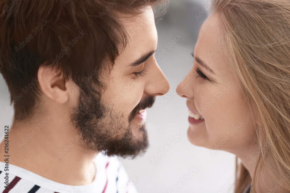 Portrait of young loving couple on blurred background, closeup Portrait of young loving couple on blurred background, closeup