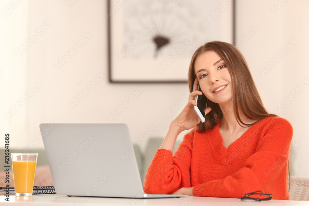 Beautiful smiling woman talking by mobile phone at home Beautiful smiling woman talking by mobile phone at home