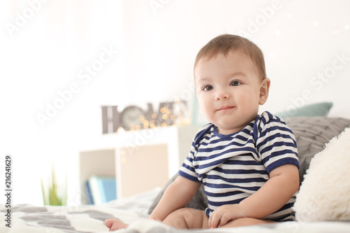 Cute baby in striped bodysu...