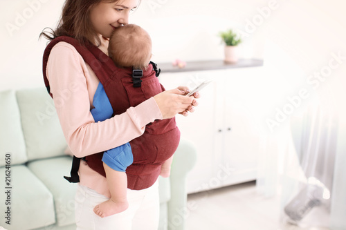 Young mother with her baby ...