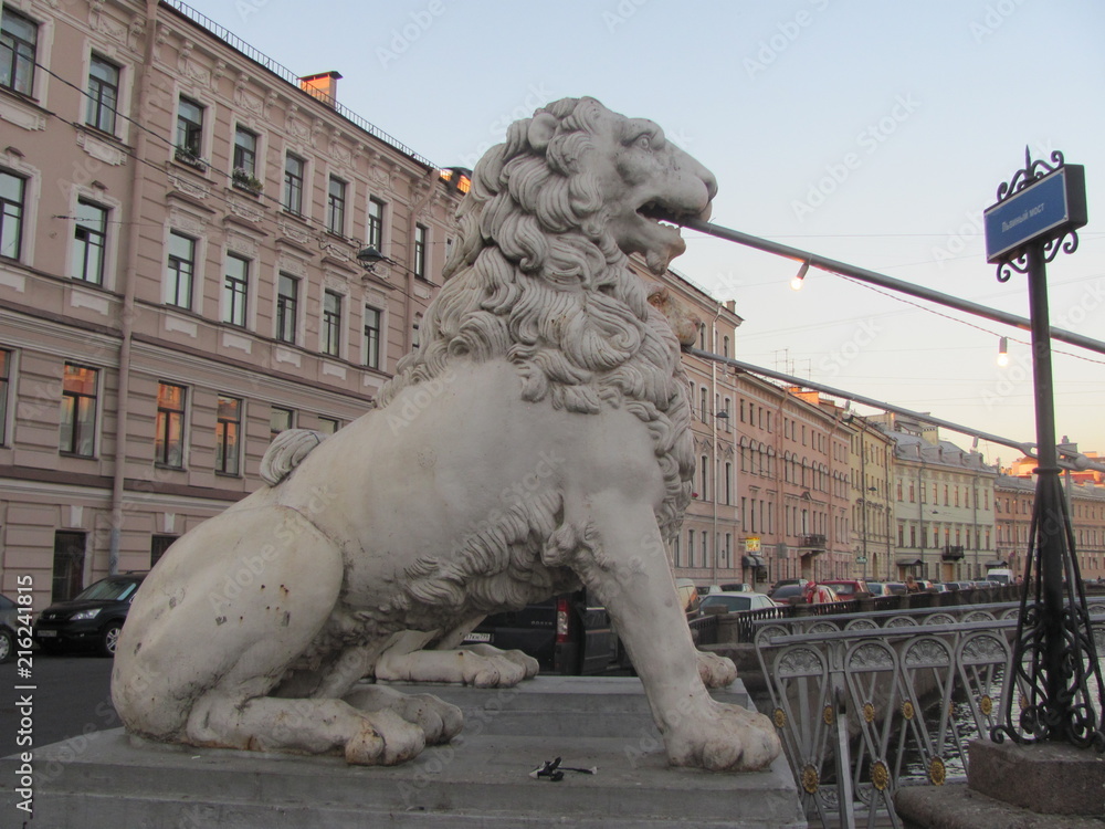 The statue of a lion on the Lion Bridge in St. Petersburg