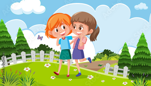 Two girls walking in a park