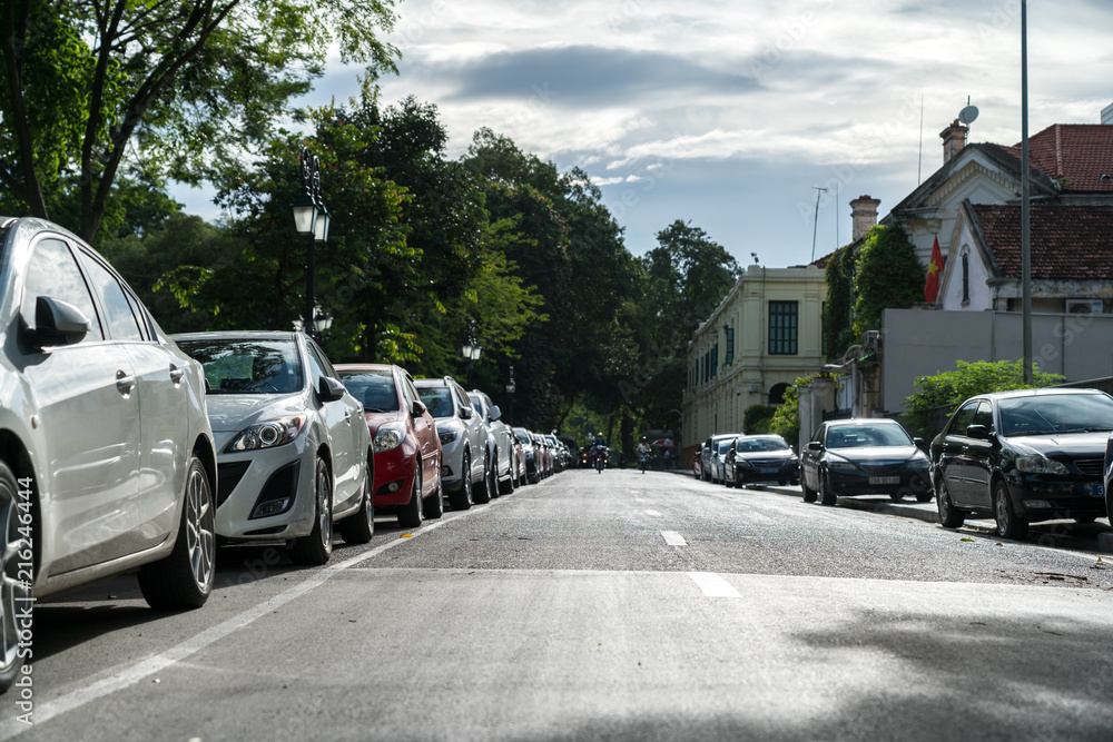 Parallel parking cars on urban street. Outdoor parking on road