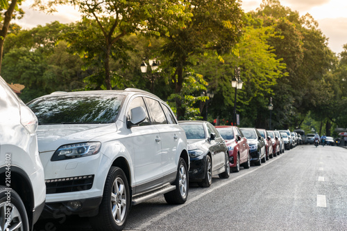 Vászonkép Parallel parking cars on urban street. Outdoor parking on road