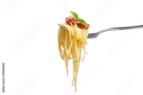 Spaghetti on fork with fresh tomato sauce, grated parmesan cheese and basil leaf for garnish, isolated on white background