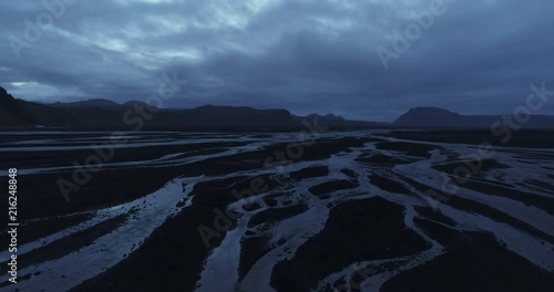 Aerial view of mysterious delta glacier rivers during twilight