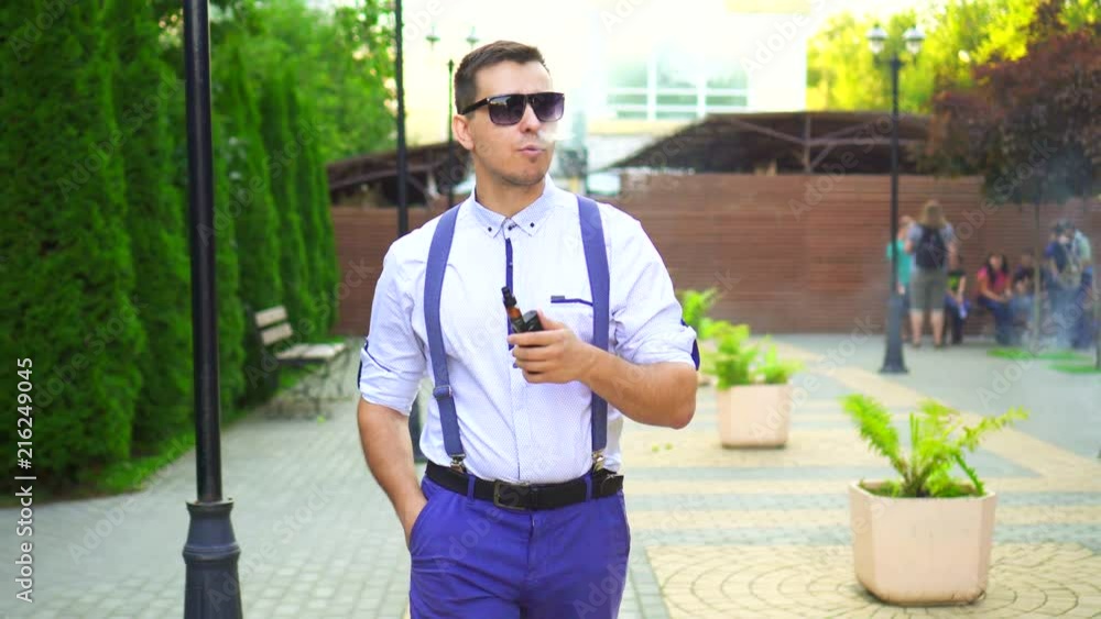 Stylish man with shirt with electronic cigarette. Stylish man with shirt with electronic cigarette.