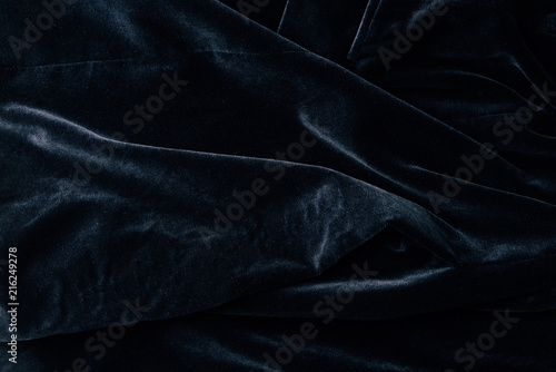 top view of black velvet textile as background photo