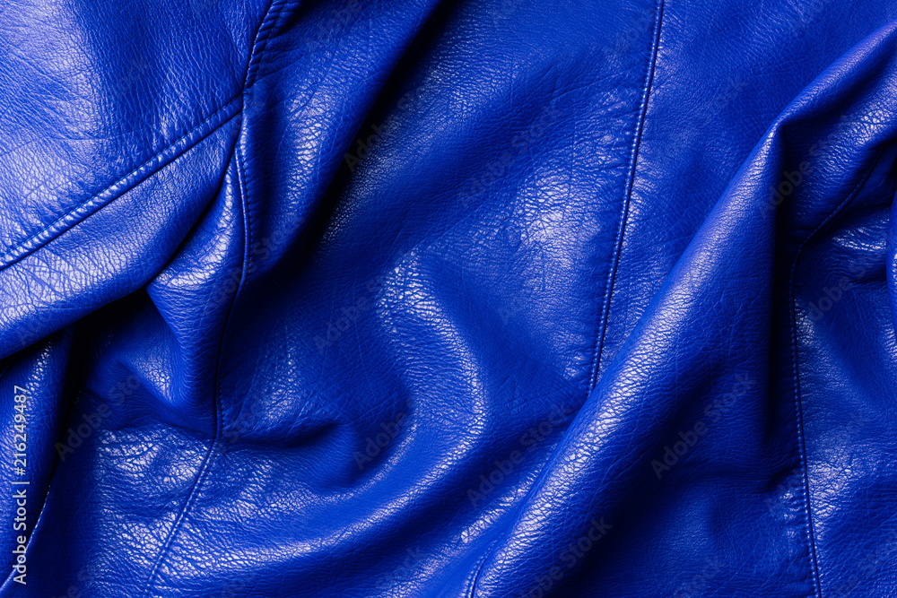 Fototapeta premium top view of dark blue leather shiny textile as background