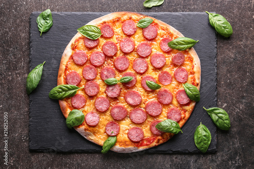 Tasty Pepperoni pizza on dark background