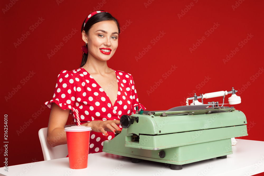 pin up girl typing on a typewriter