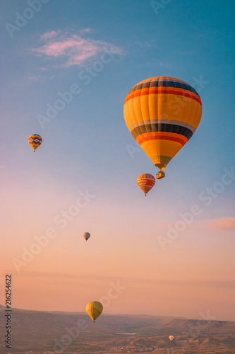 hot air balloons during snrise Cappadocia Kapadokya Turkey, Fairytale landscape hills photo