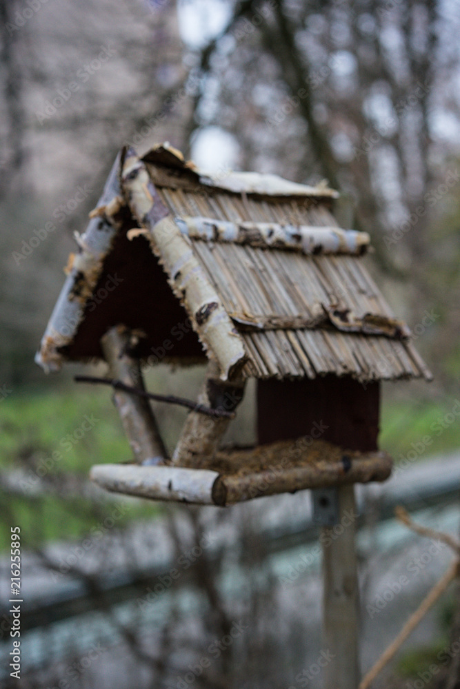 Birdhouse in winter at evening Birdhouse in winter at evening