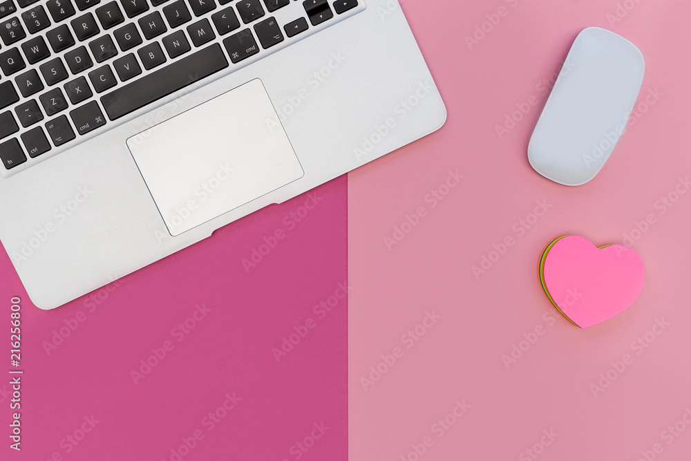Laptop computer mouse bright pink background with love heart Laptop computer mouse bright pink background with love heart