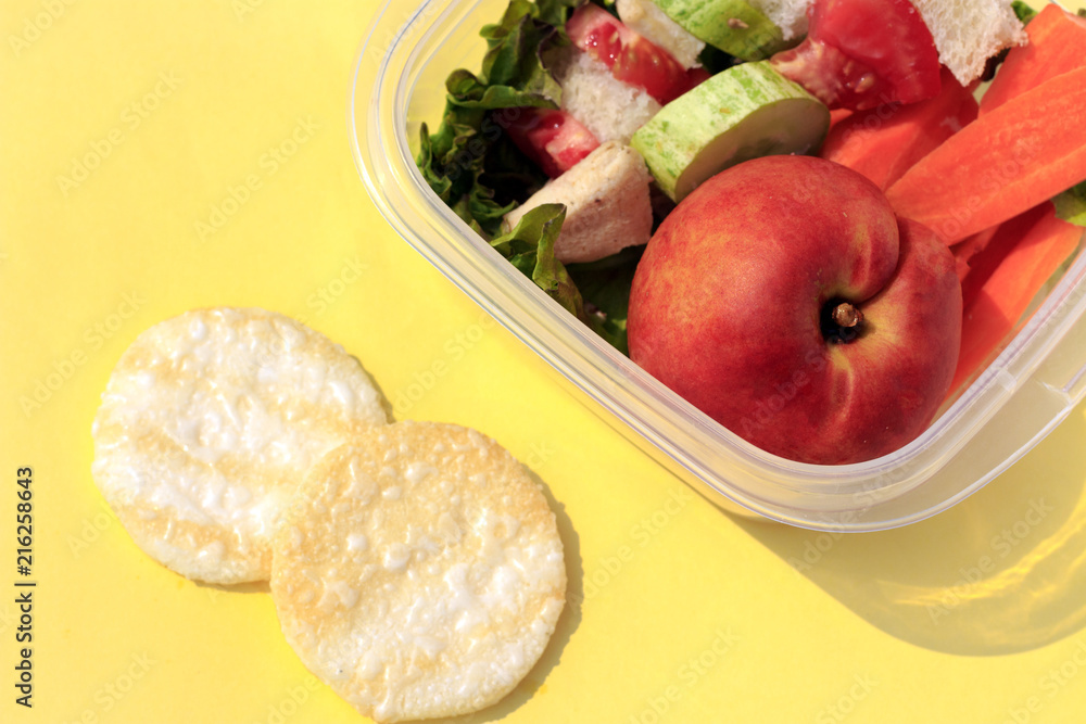 lunch of child in plastic boxes on yellow background. Top view, flat lay lunch of child in plastic boxes on yellow background. Top view, flat lay