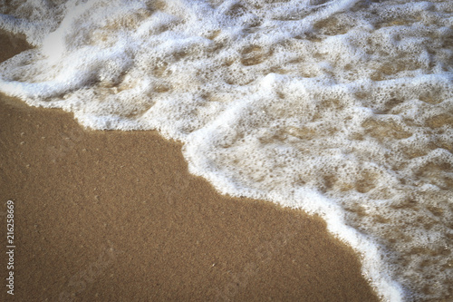 White sea foam and sand  texture  natural background  copy space