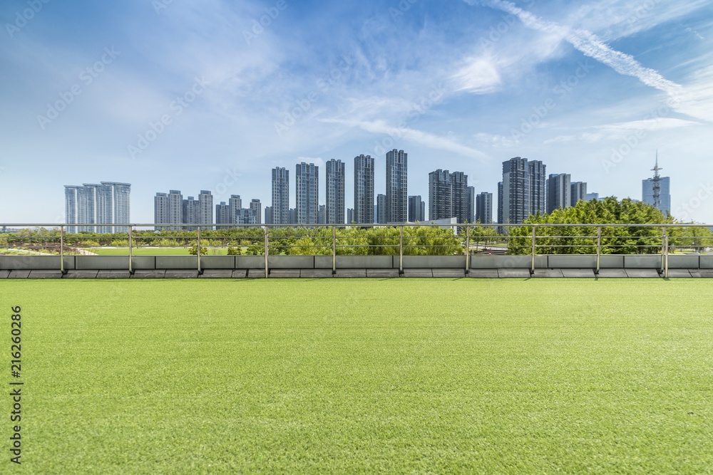 Panoramic skyline and modern business office buildings with empty road,empty concrete square floor Panoramic skyline and modern business office buildings with empty road,empty concrete square floor