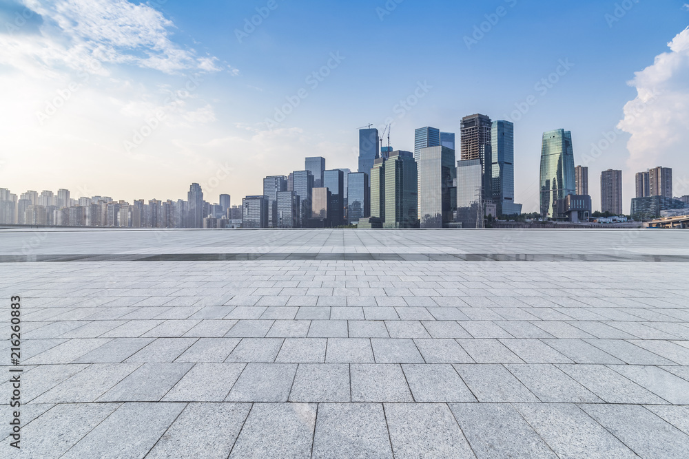 Panoramic skyline and modern business office buildings with empty road,empty concrete square floor Panoramic skyline and modern business office buildings with empty road,empty concrete square floor