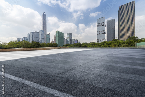 Panoramic skyline and modern business office buildings with empty road,empty concrete square floor © MyCreative