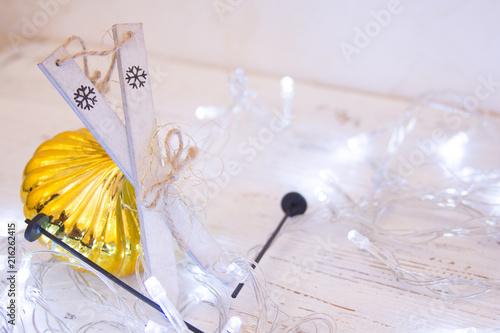 Christmas or New Year background: , colorful glass balls, decoration and glittering stars on white wood, top view, copy space.