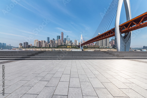 Panoramic skyline and modern business office buildings with empty road,empty concrete square floor © MyCreative