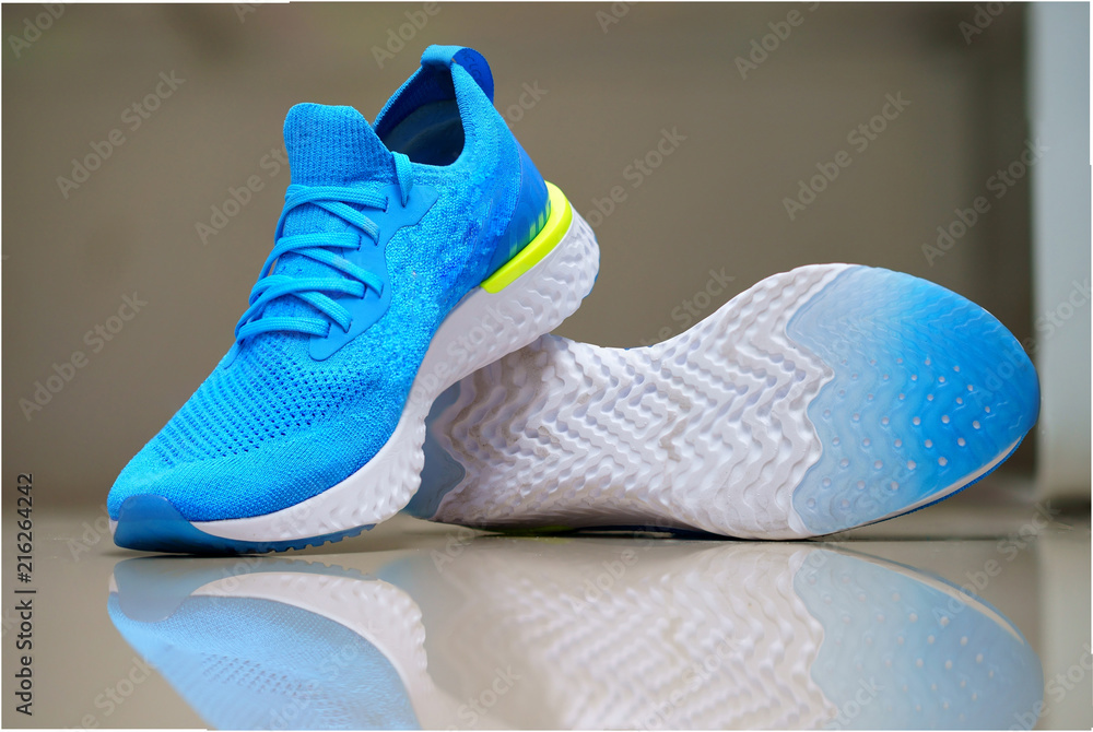 navy blue sport or running shoes in display on blur background navy blue sport or running shoes in display on blur background