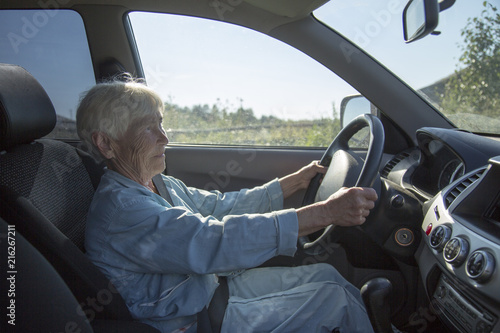 an elderly woman driving