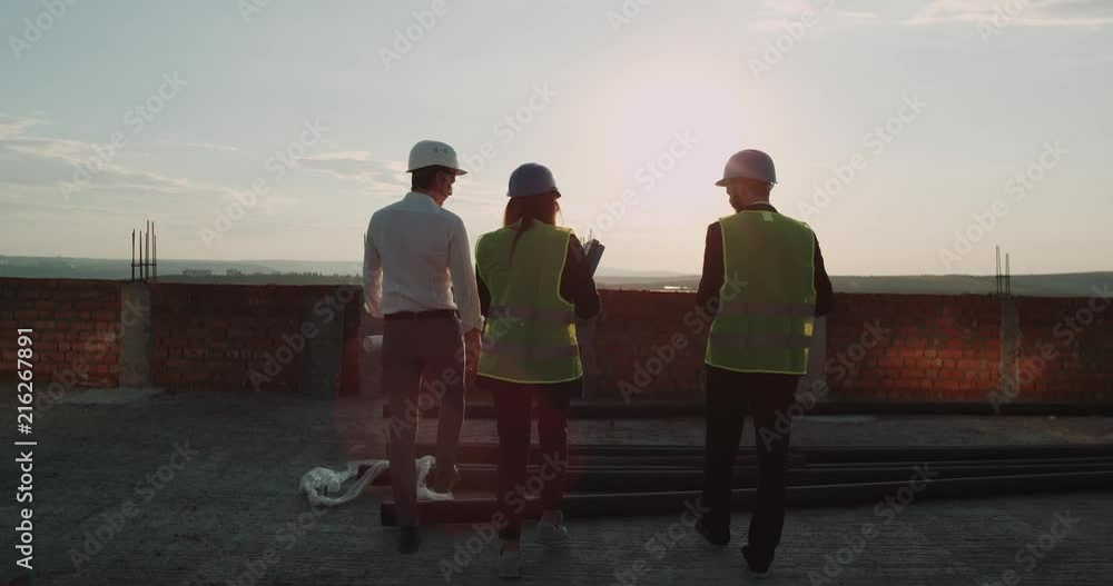 Construction site on top of building with amazing sunset three ...
